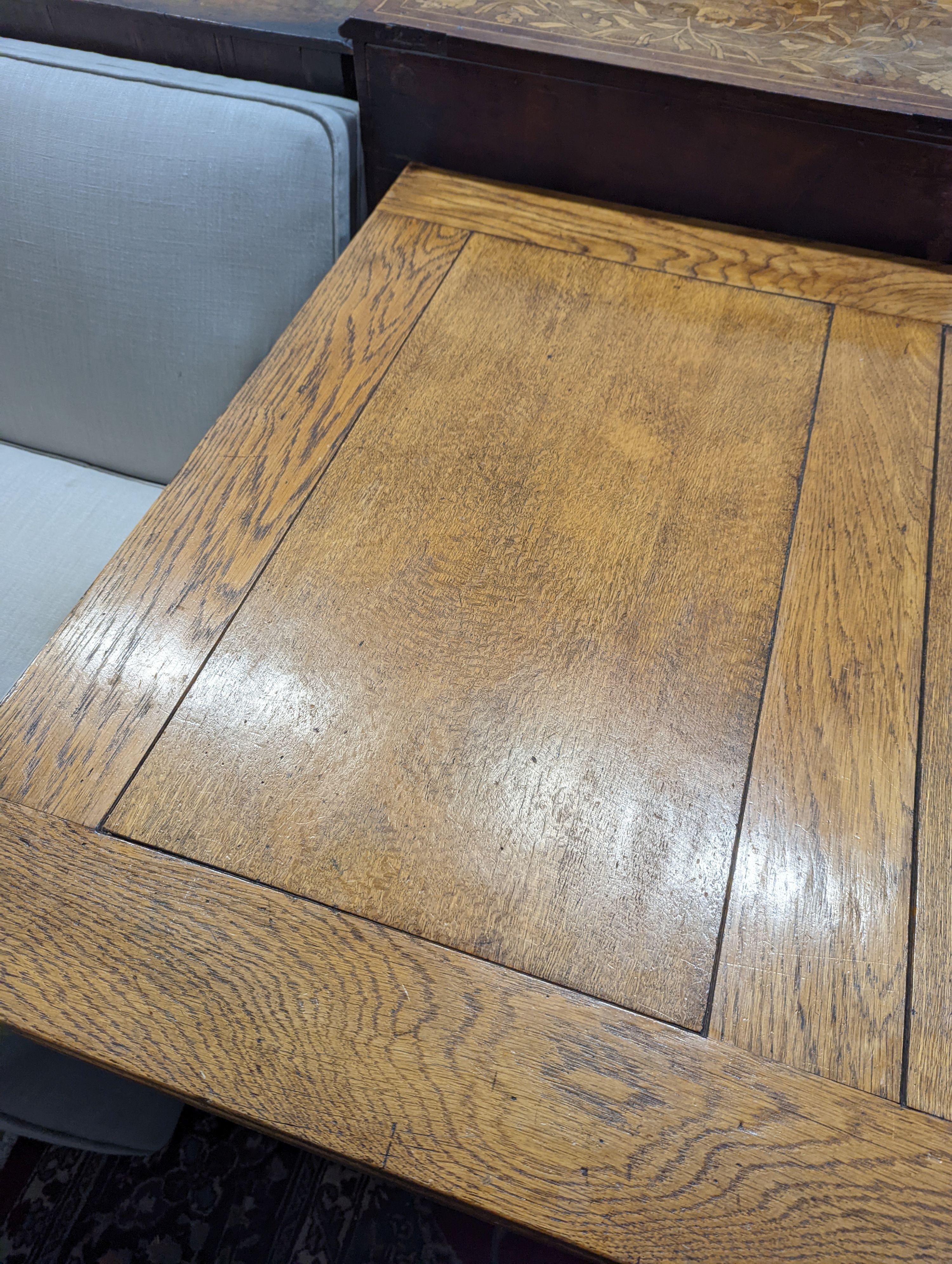 An 18th century style pale oak draw leaf dining table on carved baluster legs, length 242cm extended, depth 91cm, height 75cm